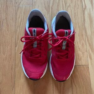 Red Nike revolution running sneakers